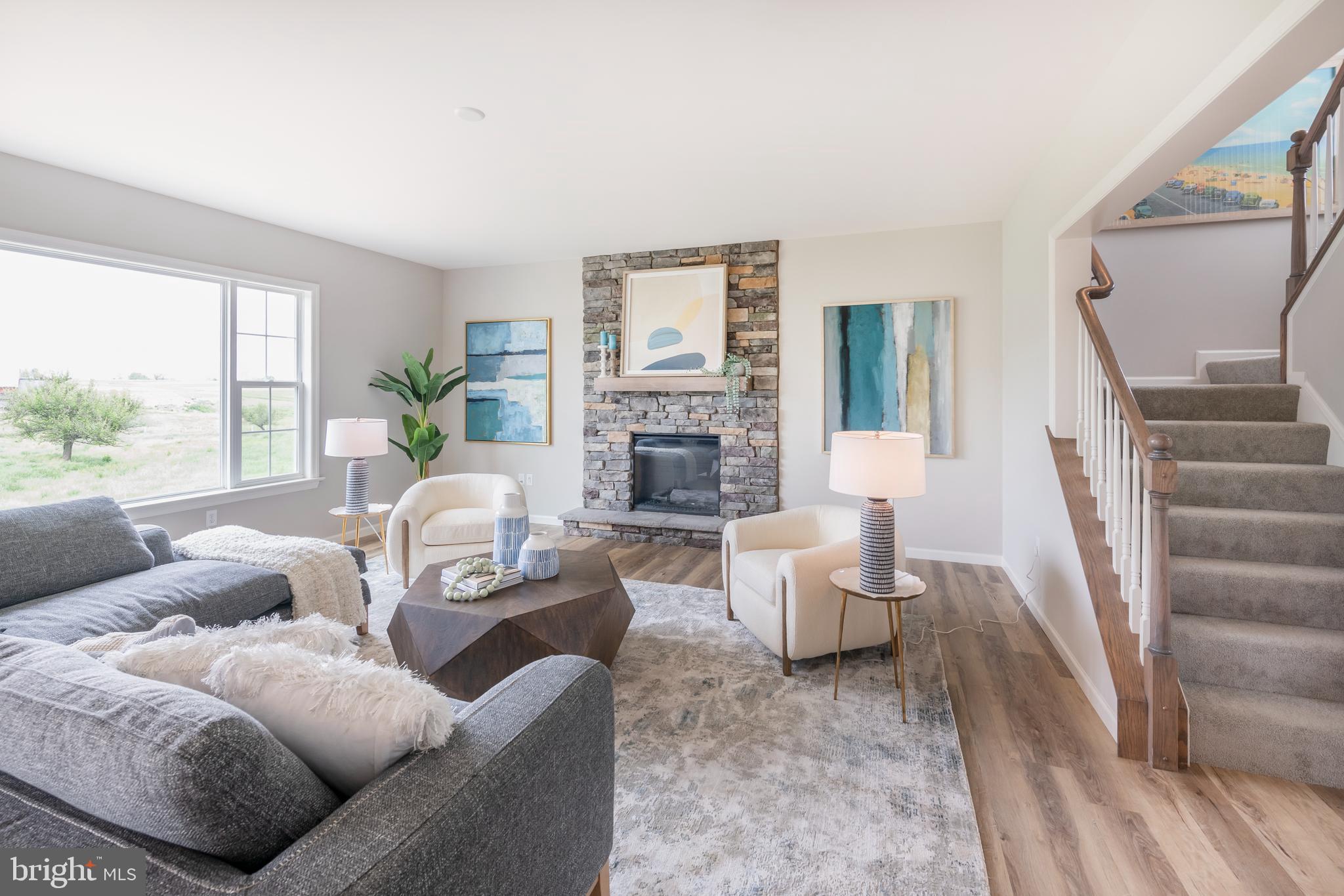 4 Old Orch Road Strasburg, PA 17579 - Photo 9 of 25 a living room with furniture fireplace and a large window