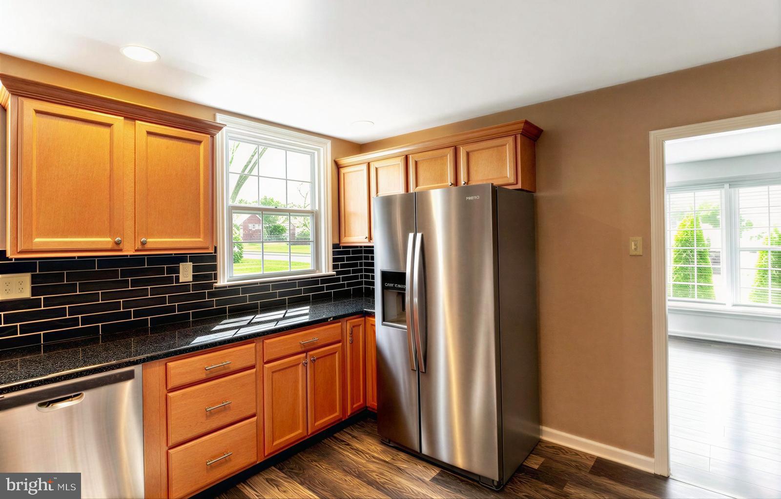 107 Valley View Road Norristown, PA 19401 - Photo 11 of 35 a kitchen with stainless steel appliances granite countertop a refrigerator and a sink