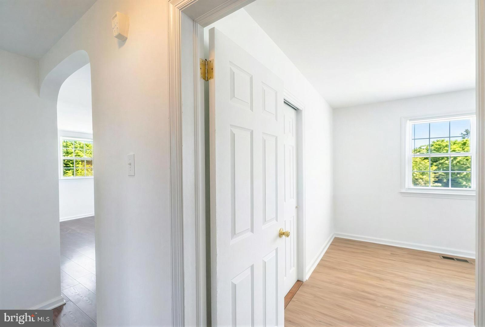 107 Valley View Road Norristown, PA 19401 - Photo 17 of 35 a view of a hallway with wooden floor and a window