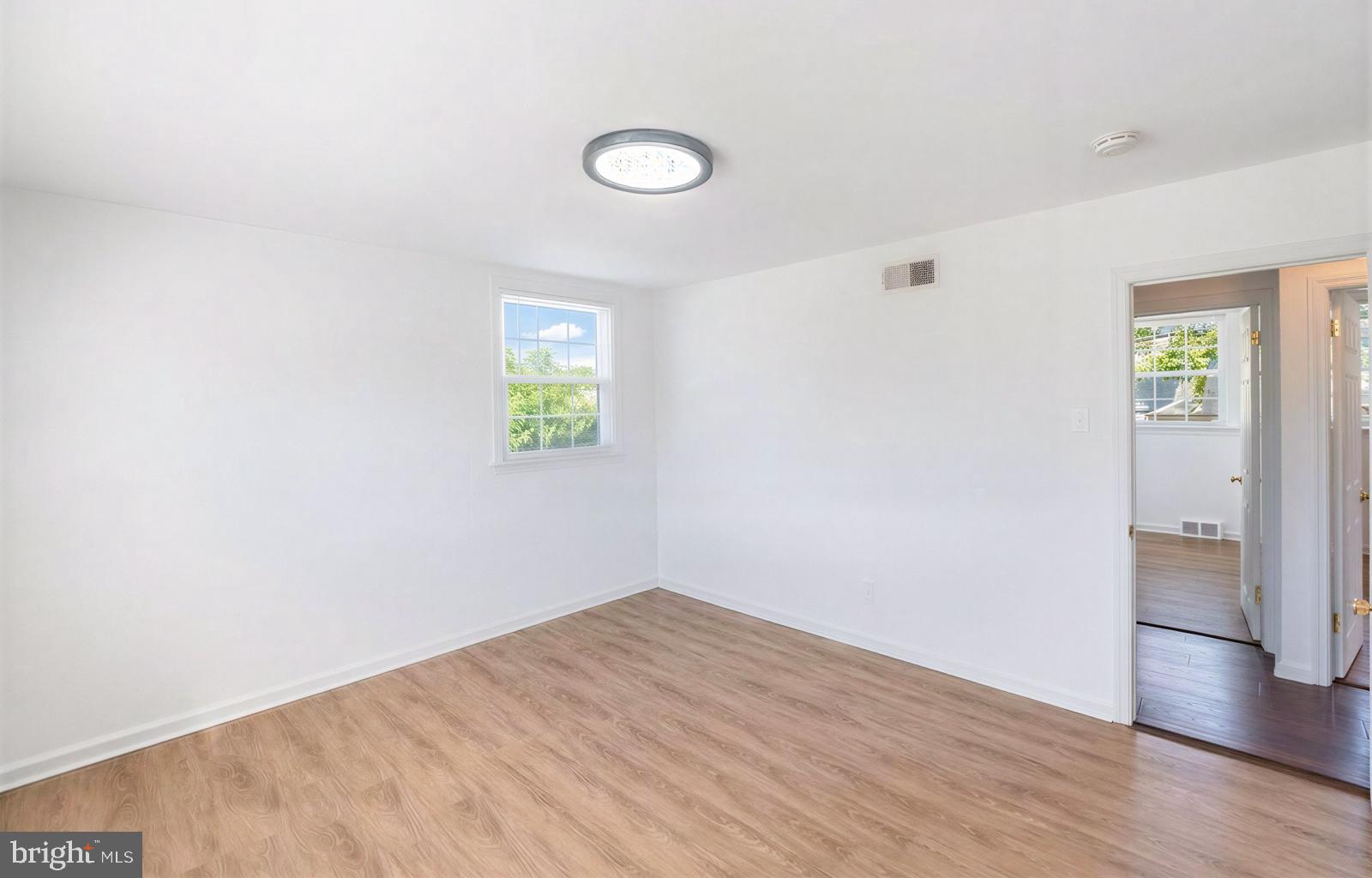 107 Valley View Road Norristown, PA 19401 - Photo 18 of 35 a view of empty room with wooden floor and window