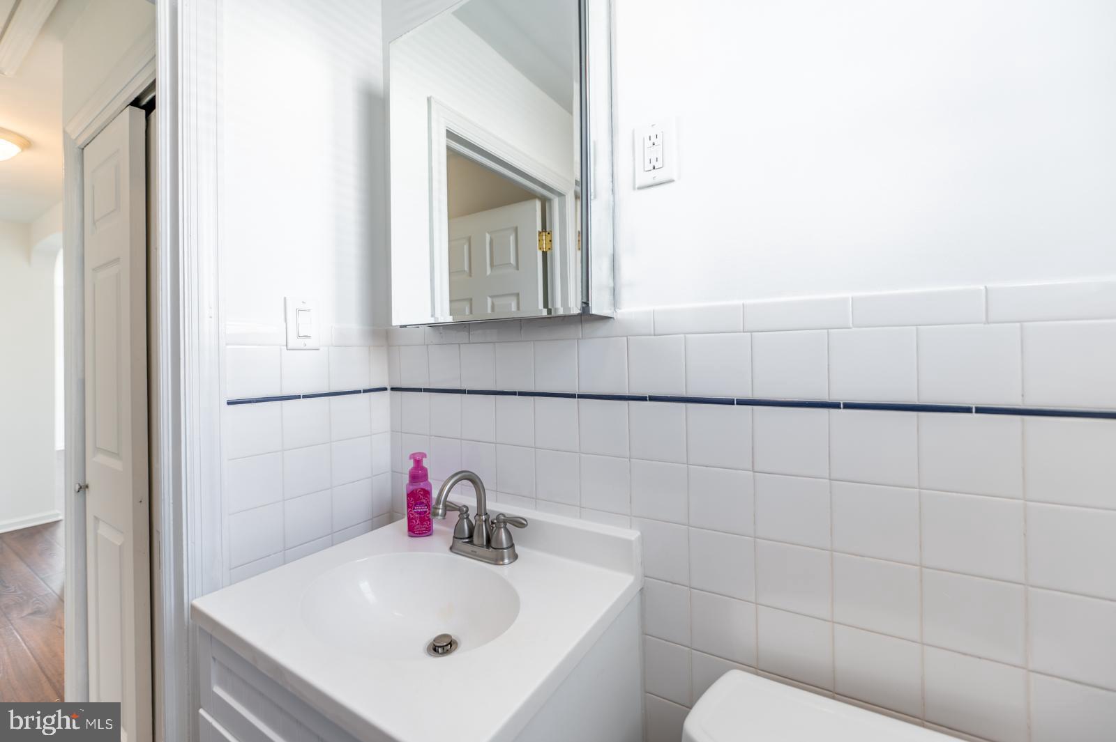 107 Valley View Road Norristown, PA 19401 - Photo 20 of 35 a bathroom with a sink and a mirror