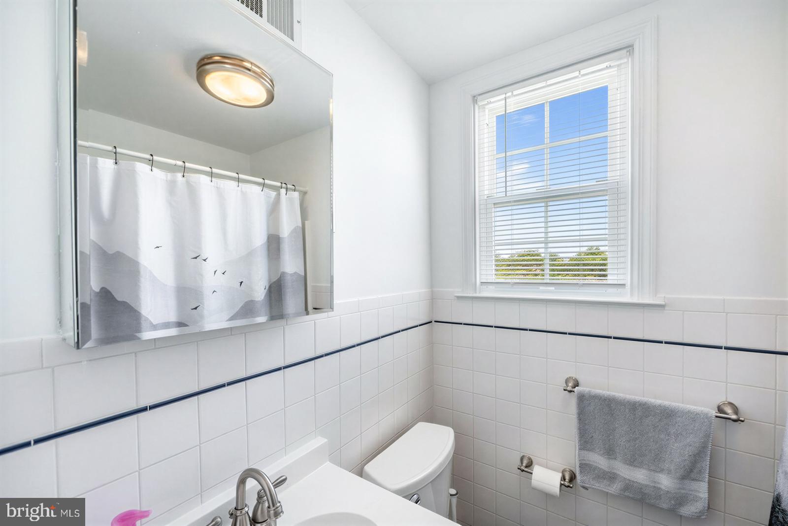 107 Valley View Road Norristown, PA 19401 - Photo 22 of 35 a bathroom with a sink and a mirror