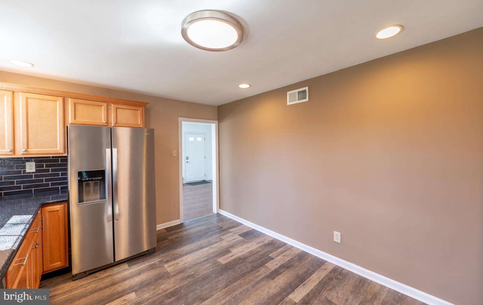 107 Valley View Road Norristown, PA 19401 - Photo 10 of 35 an empty room with wooden floor and windows