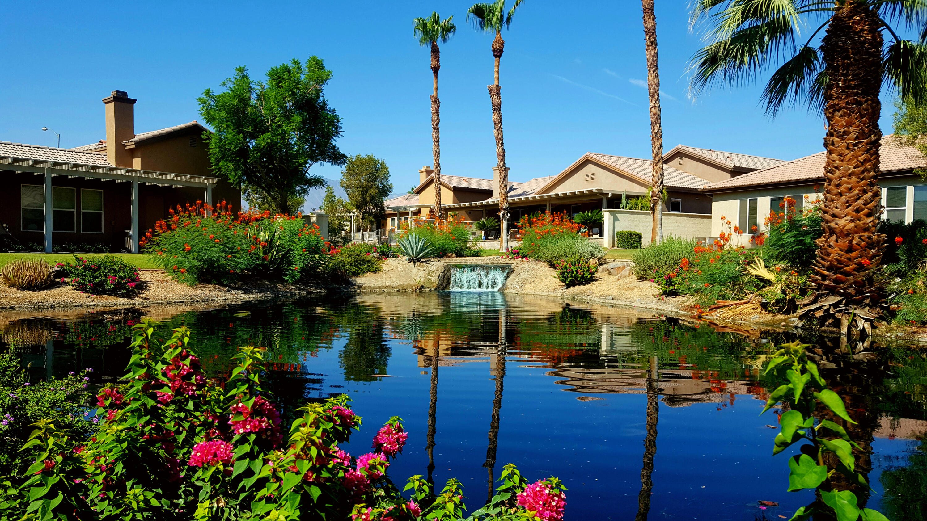 a view of a house with swimming pool garden and patio
