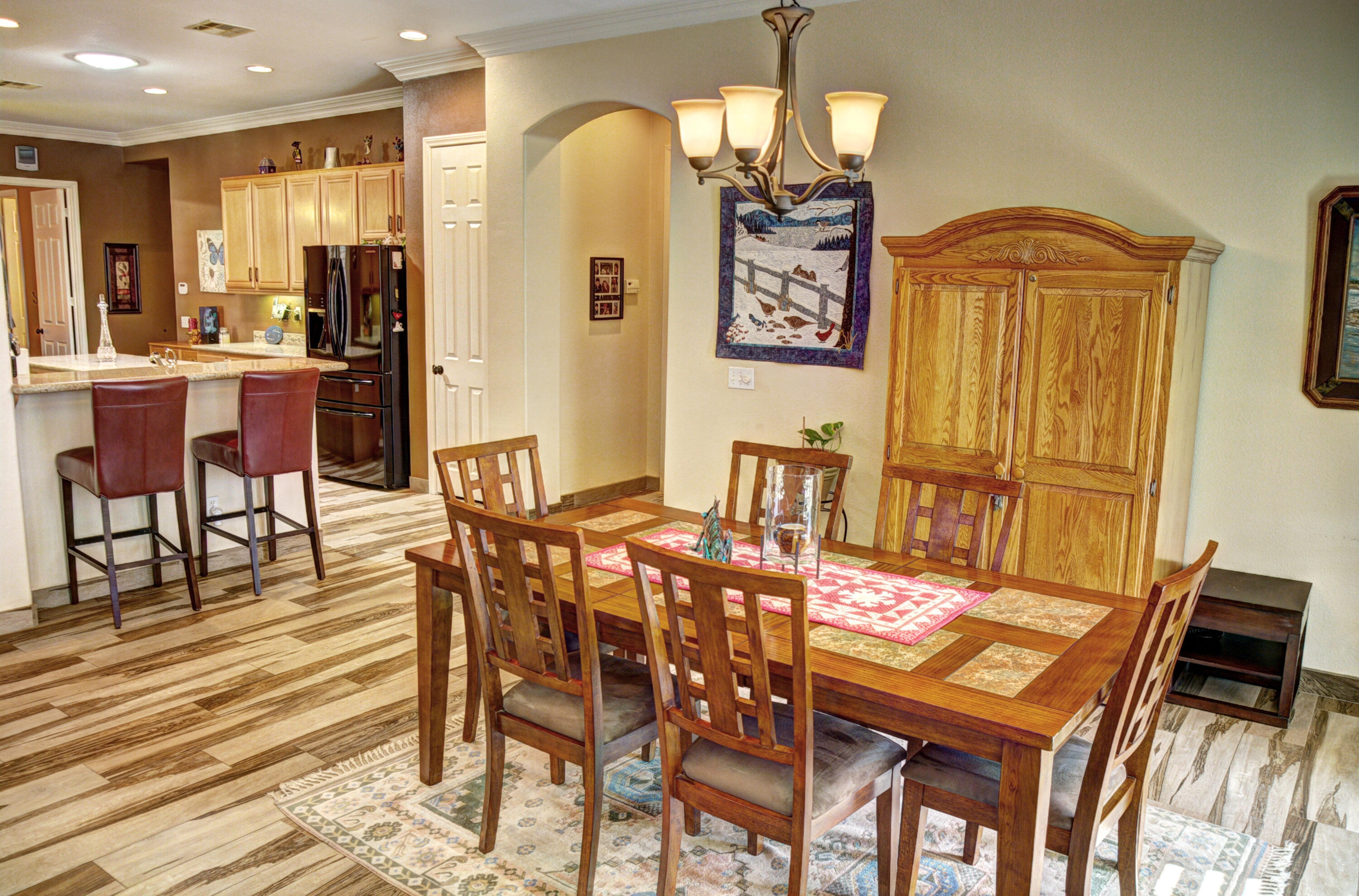 49714 Newman Circle Indio, CA 92201 - Photo 17 of 42 a view of a dining room with furniture and chandelier