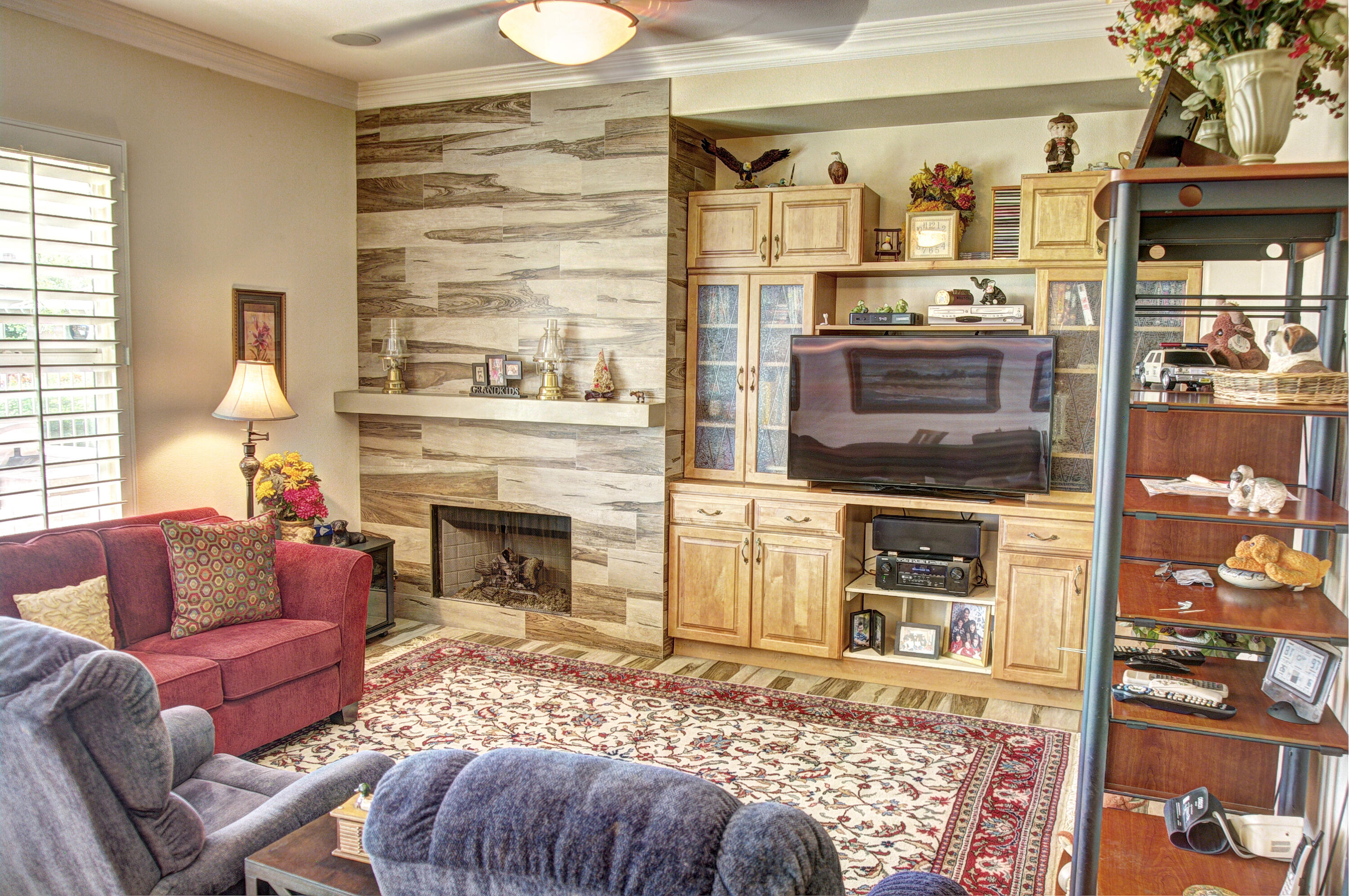 49714 Newman Circle Indio, CA 92201 - Photo 2 of 42 a living room with furniture and a fireplace