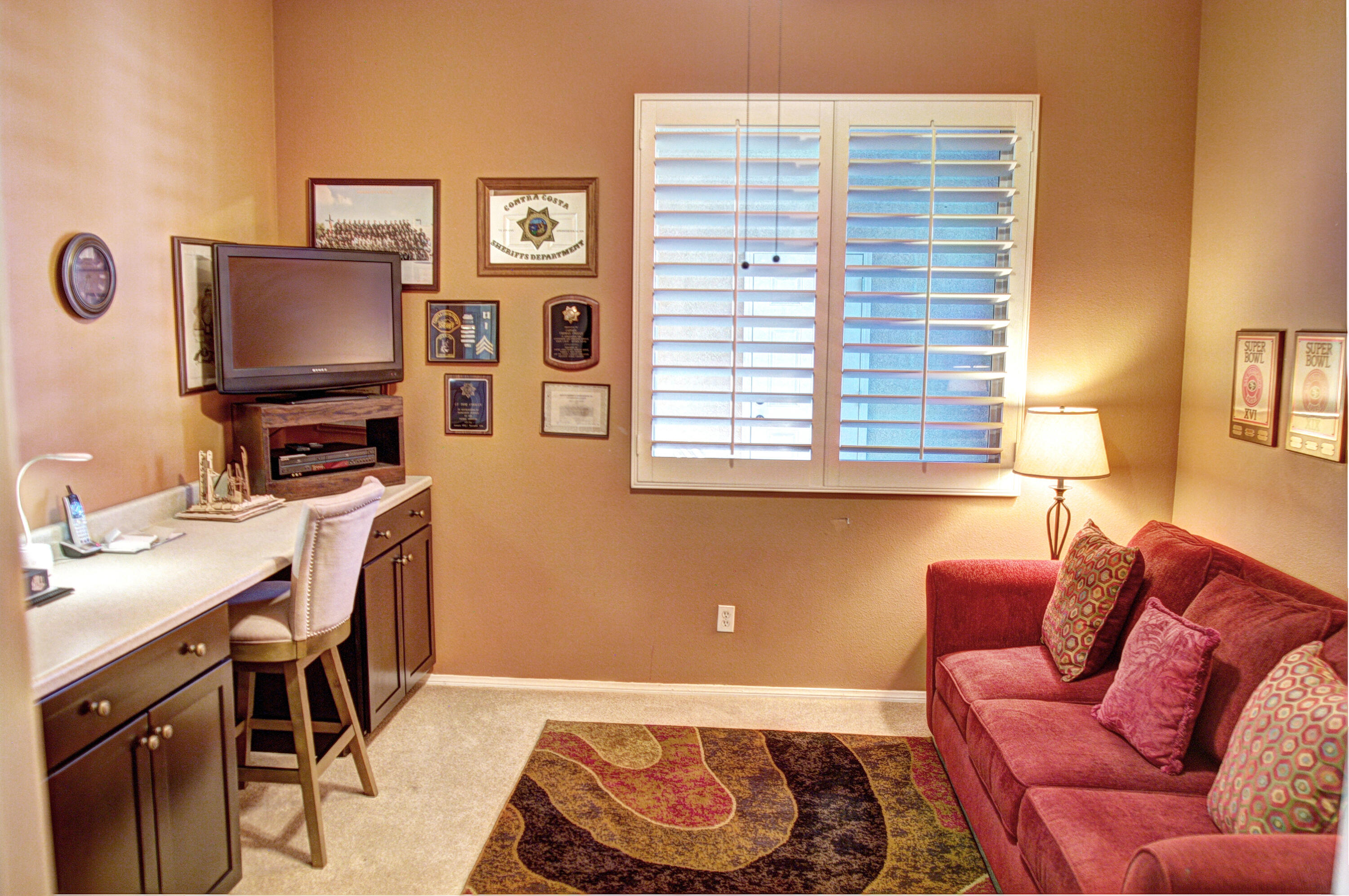 49714 Newman Circle Indio, CA 92201 - Photo 23 of 42 a living room with furniture and a flat screen tv