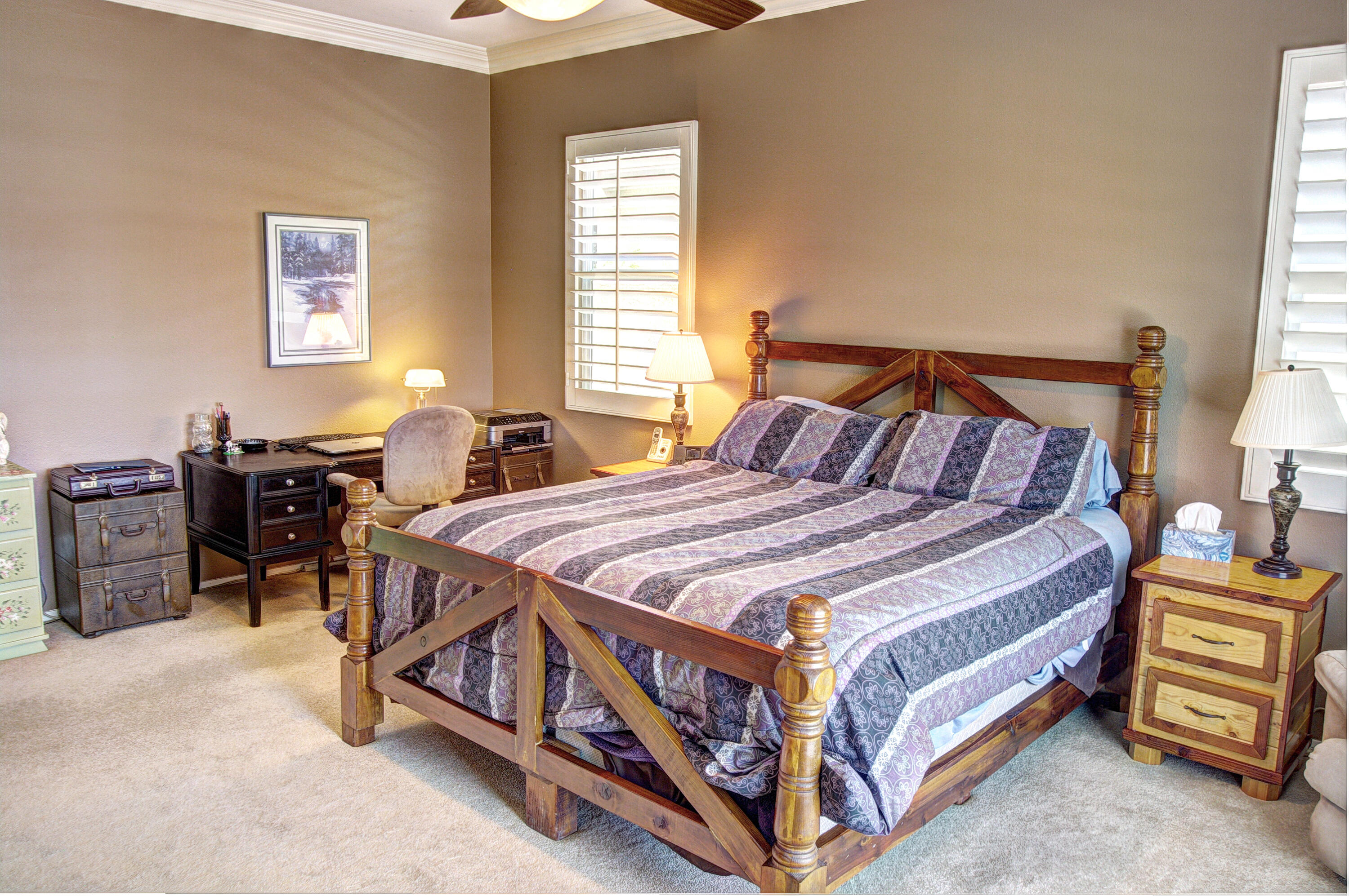 49714 Newman Circle Indio, CA 92201 - Photo 27 of 42 a bed sitting in a bedroom next to a window