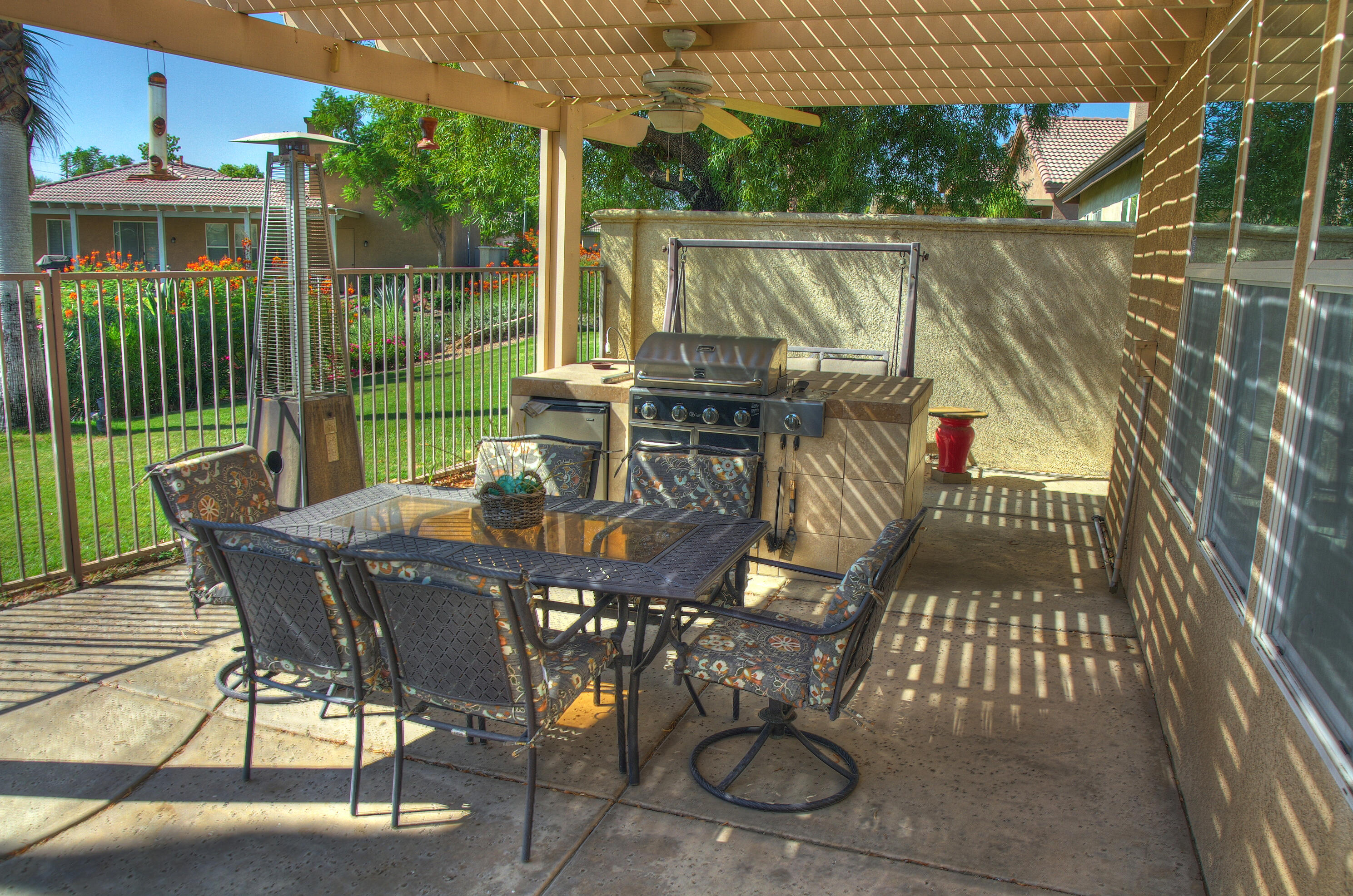 49714 Newman Circle Indio, CA 92201 - Photo 32 of 42 a view of a patio with a table chairs and backyard