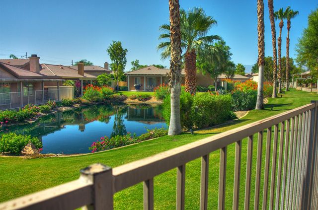 a view of a garden from a balcony