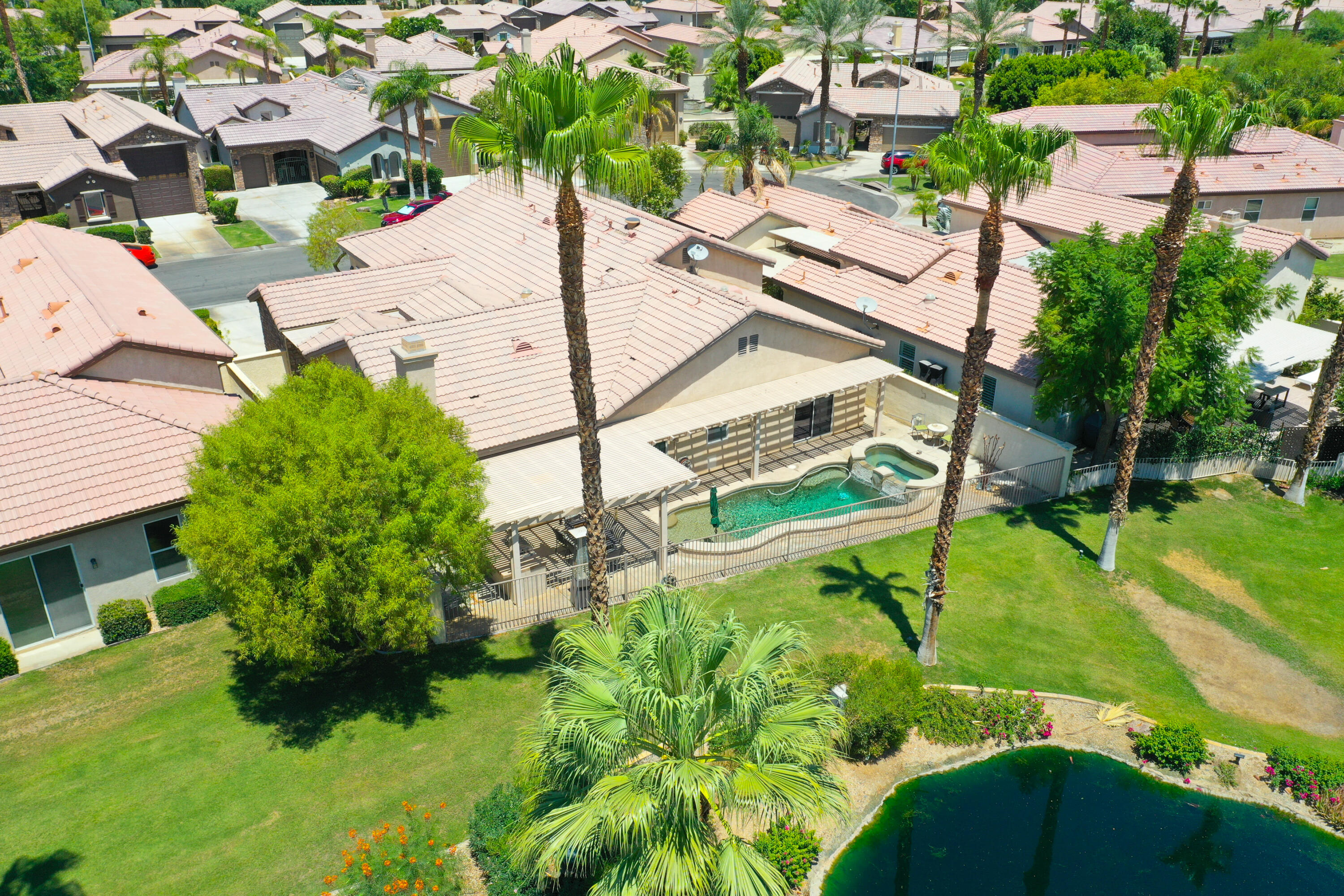 49714 Newman Circle Indio, CA 92201 - Photo 39 of 42 an aerial view of a house with a garden and plants