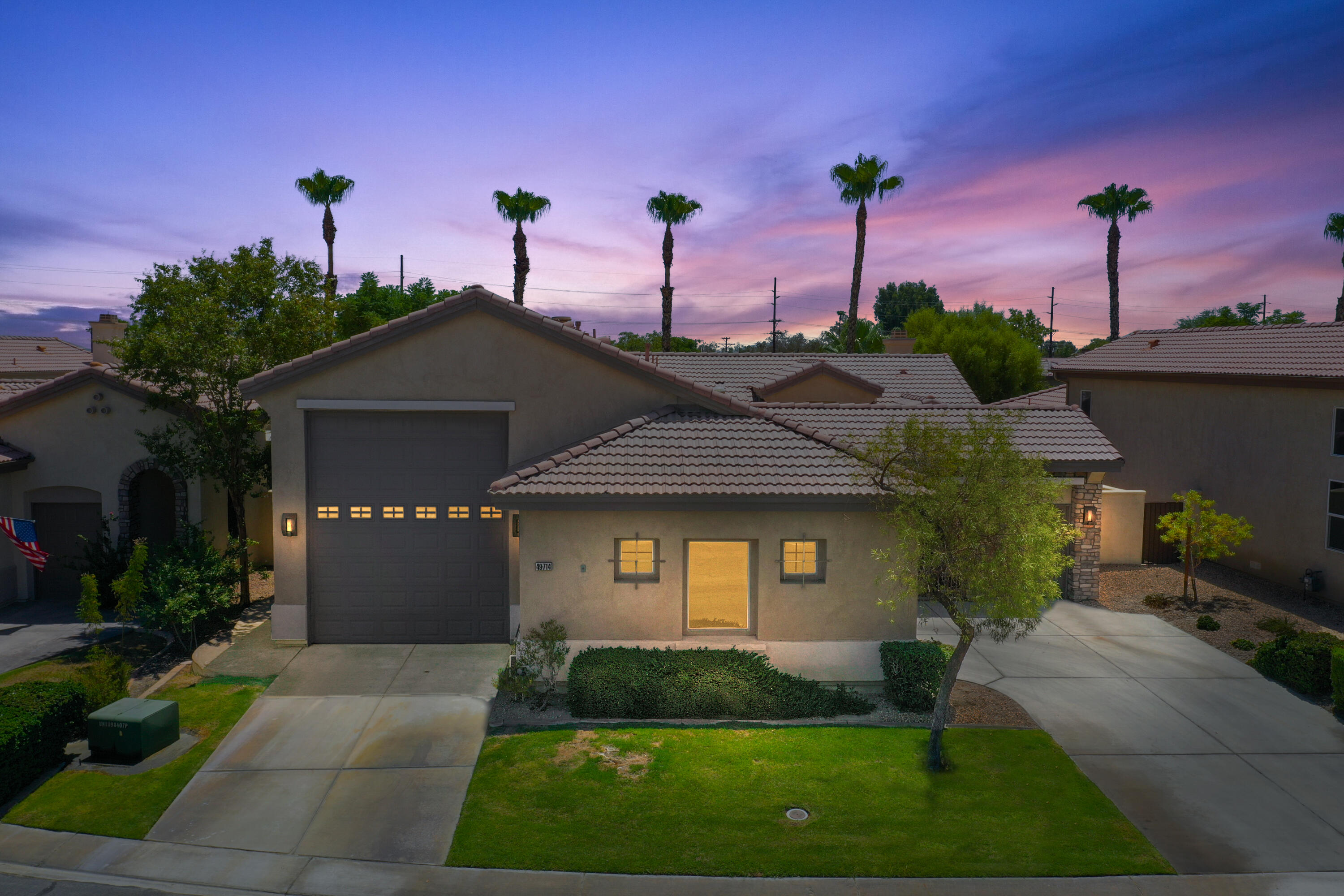 49714 Newman Circle Indio, CA 92201 - Photo 41 of 42 a front view of a house with a yard