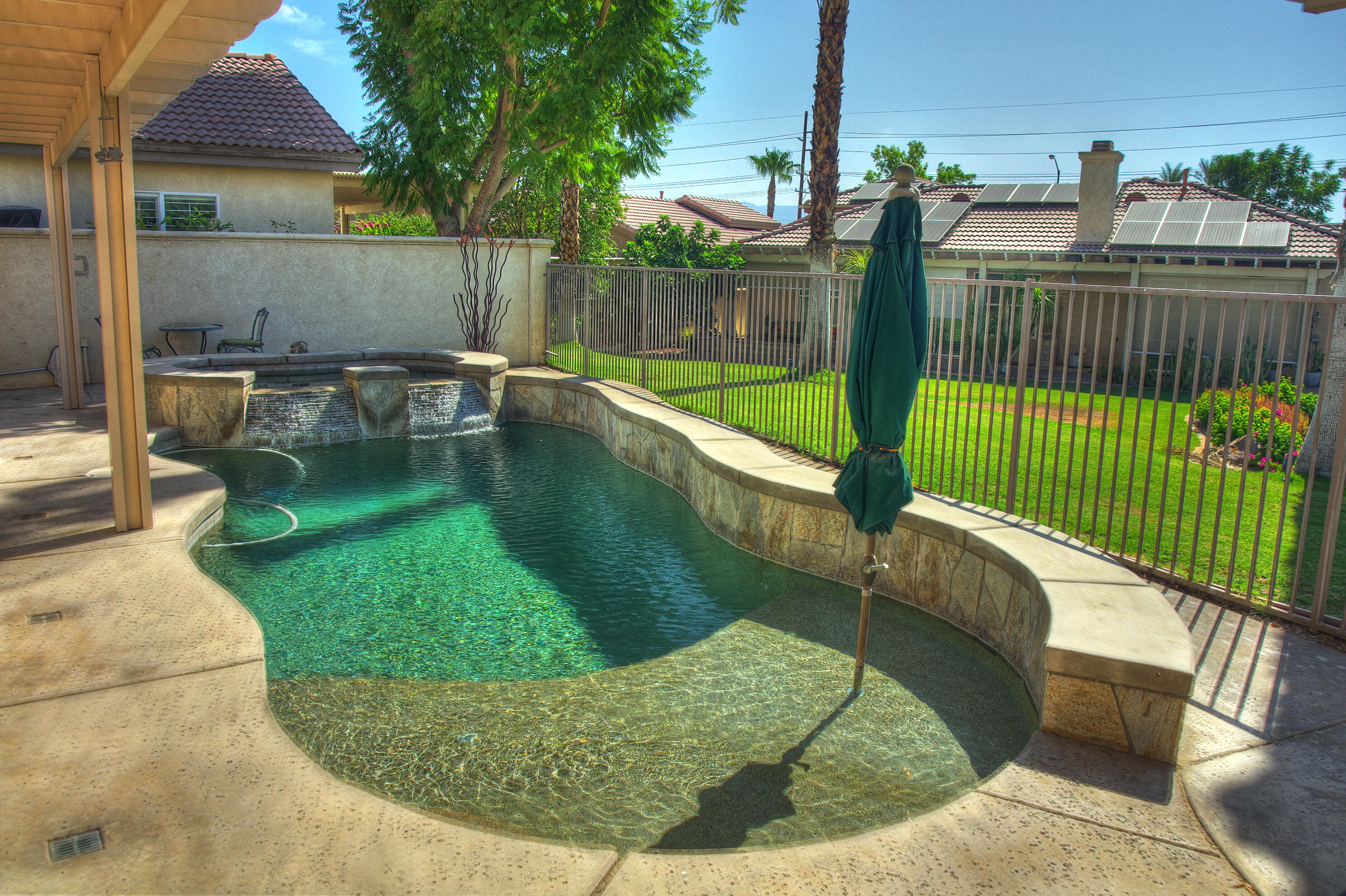 49714 Newman Circle Indio, CA 92201 - Photo 5 of 42 a view of swimming pool from a lounge chairs