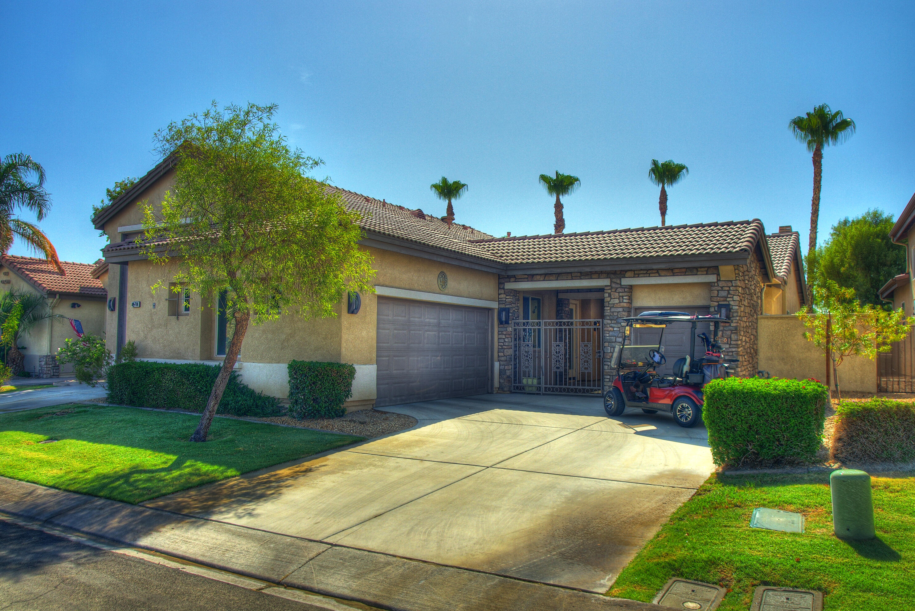 49714 Newman Circle Indio, CA 92201 - Photo 9 of 42 a house view with a garden space
