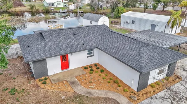 swimming pool view with a backyard space