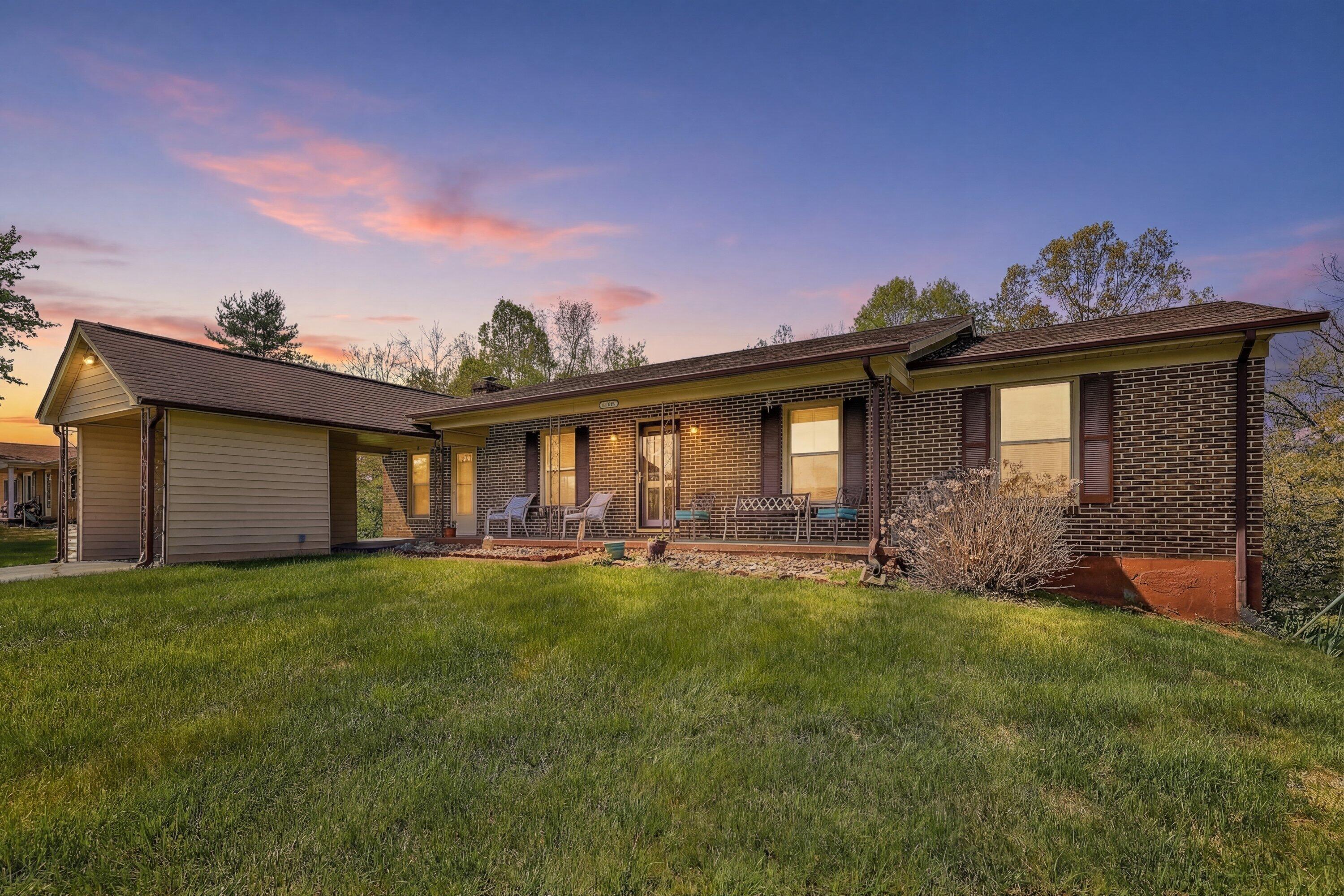 a view of a house with a yard