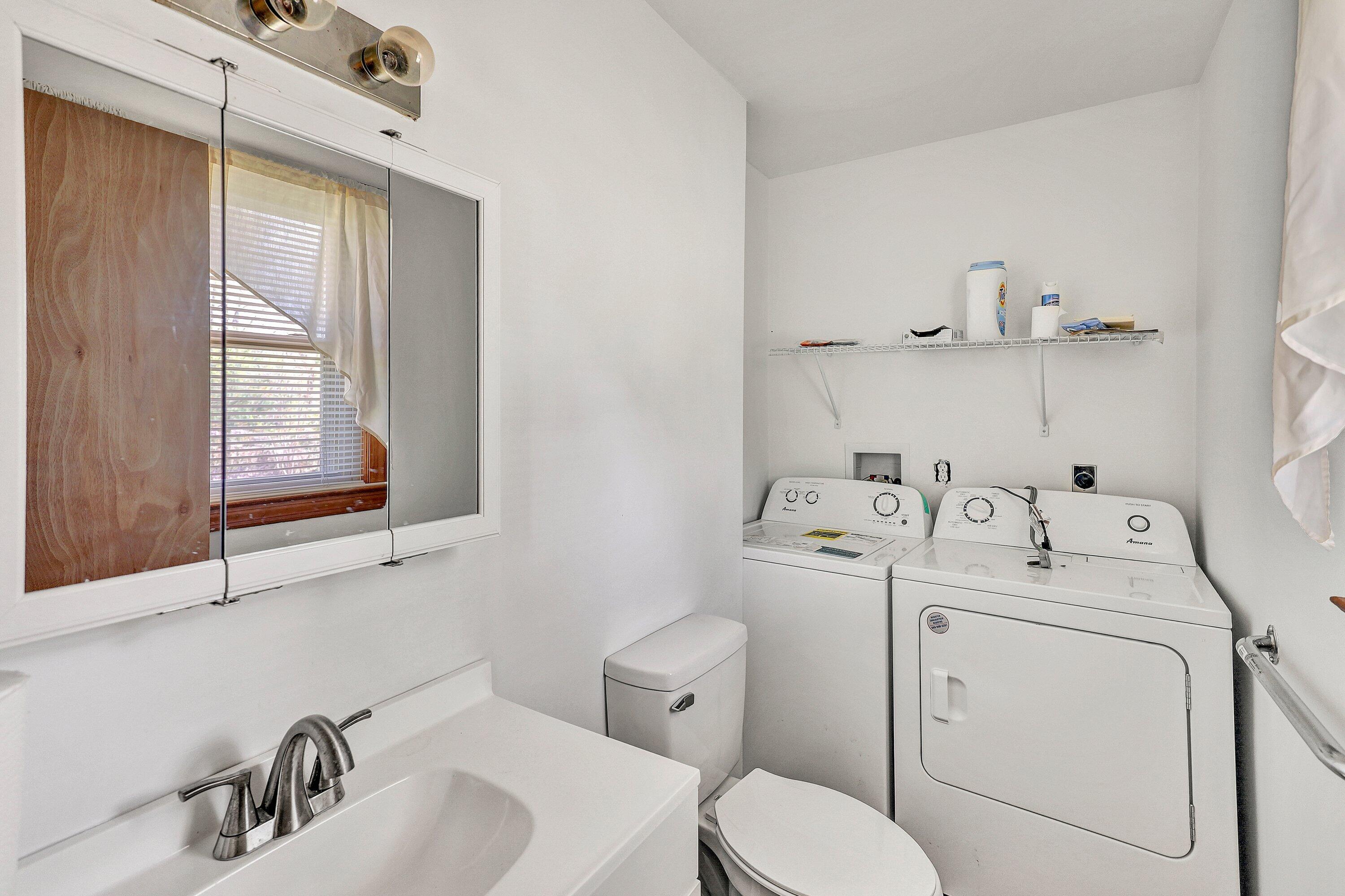 509 Carver Road Martinsville, VA 24112 - Photo 16 of 25 a bathroom with a sink a toilet and a mirror
