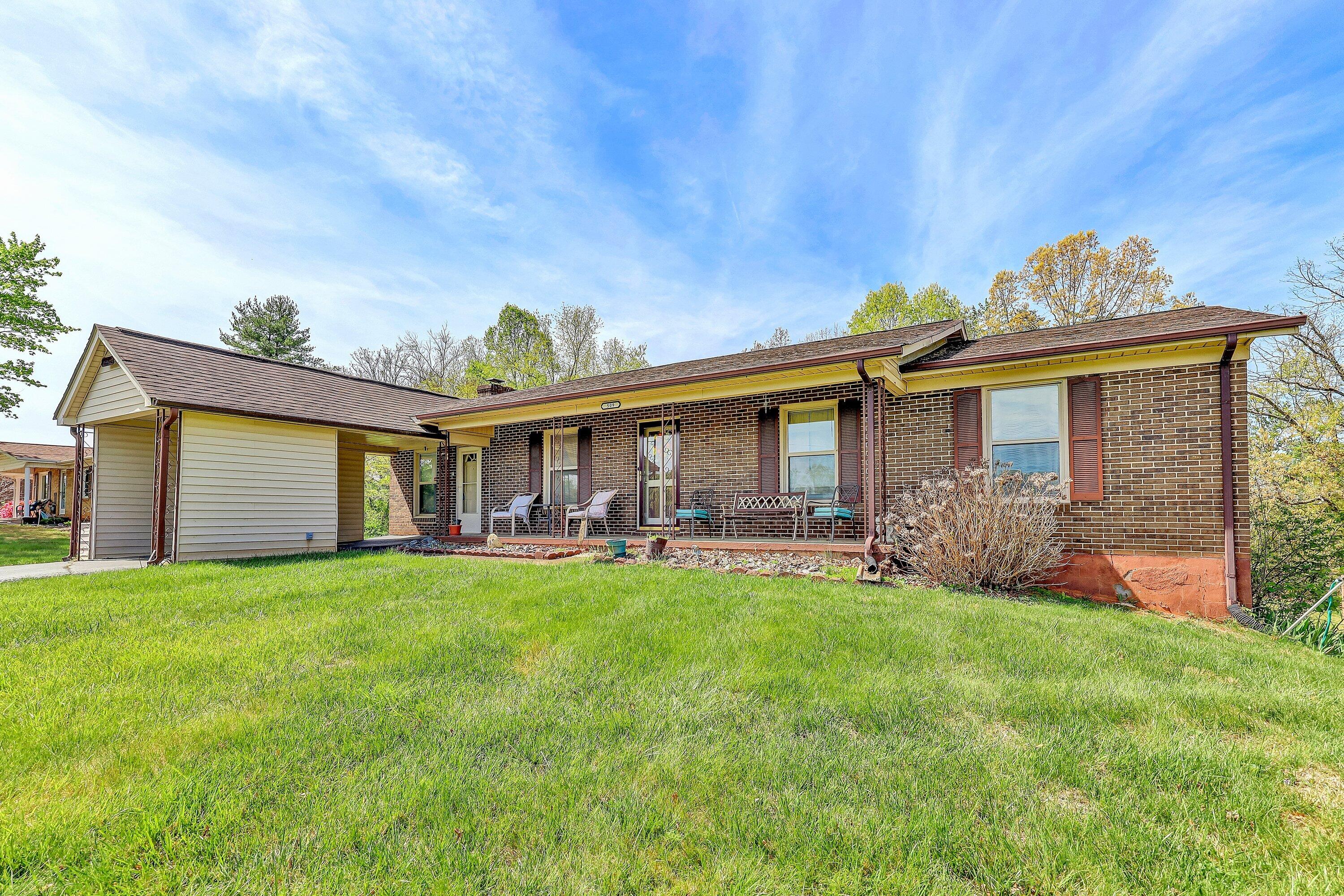 509 Carver Road Martinsville, VA 24112 - Photo 2 of 25 a view of a house with a yard and sitting area