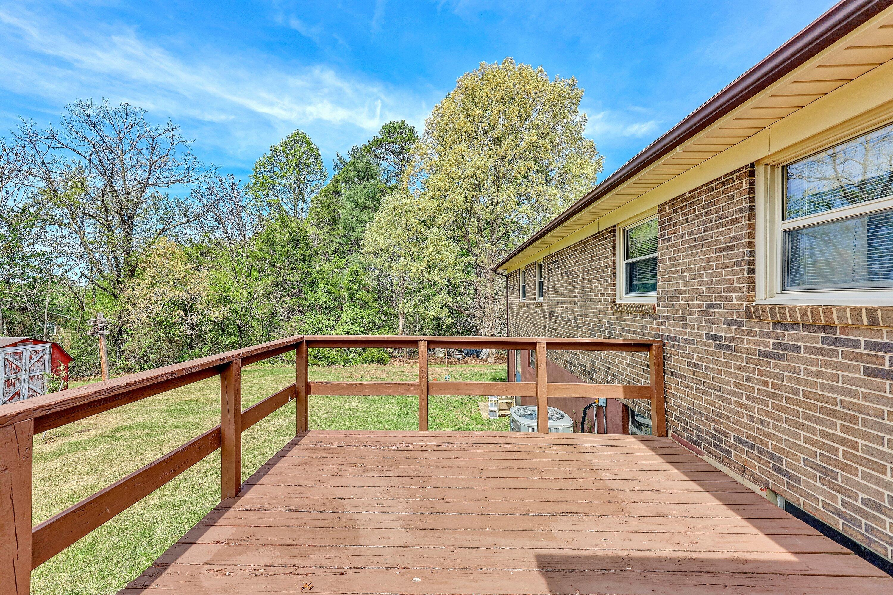 509 Carver Road Martinsville, VA 24112 - Photo 22 of 25 a view of a balcony with wooden floor and fence