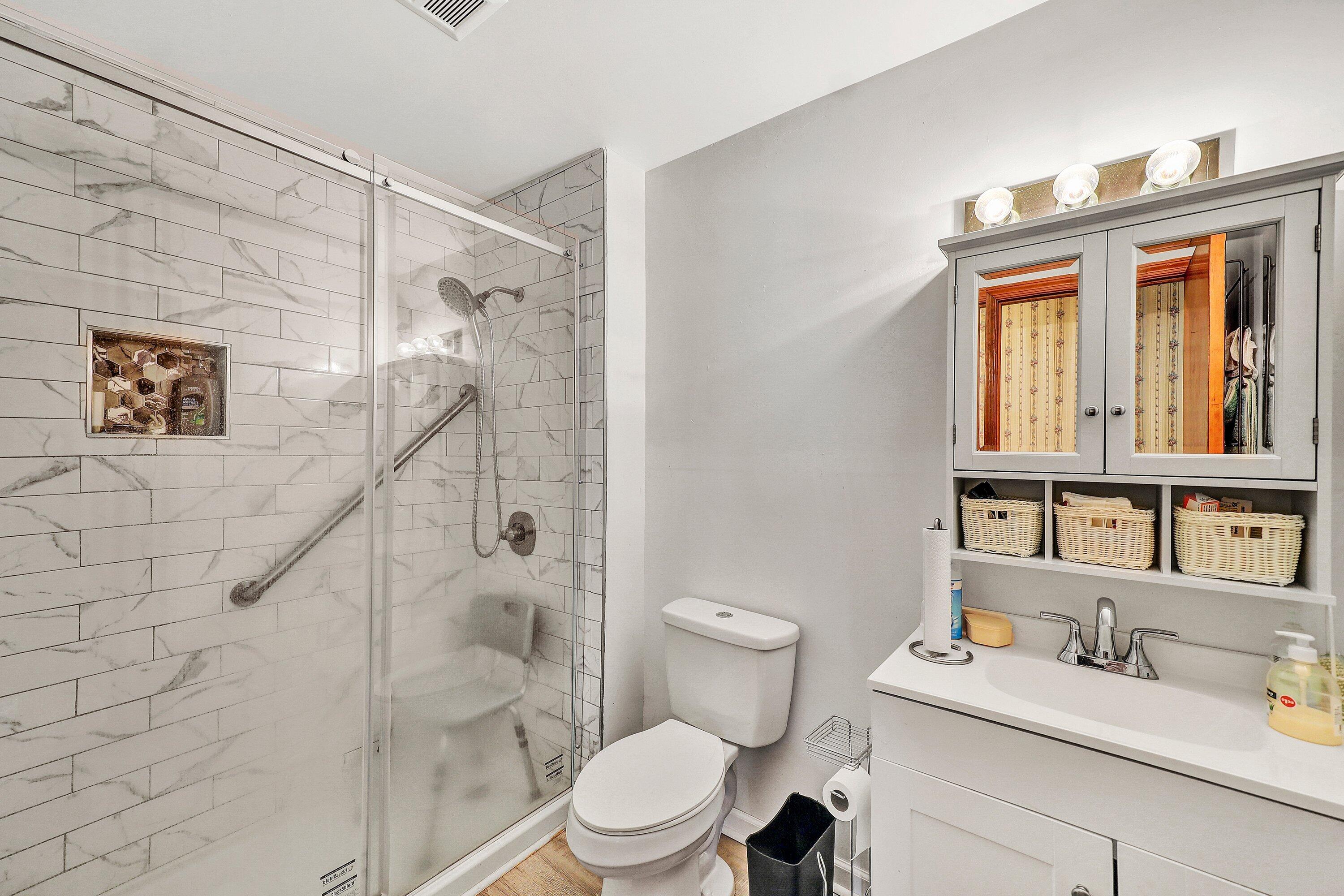 509 Carver Road Martinsville, VA 24112 - Photo 9 of 25 a white toilet sitting next to a bathroom sink