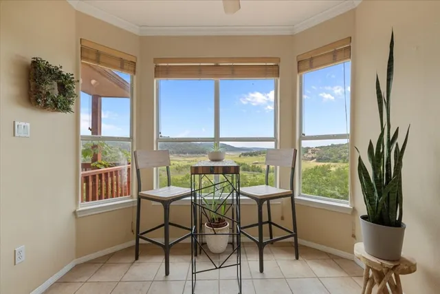 a view of a dining room with furniture window and outside view