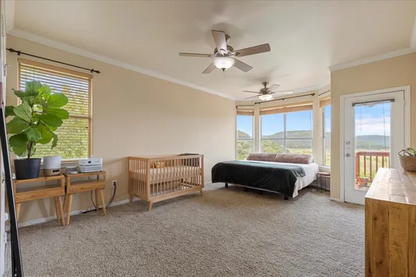 a bedroom with a bed and a window