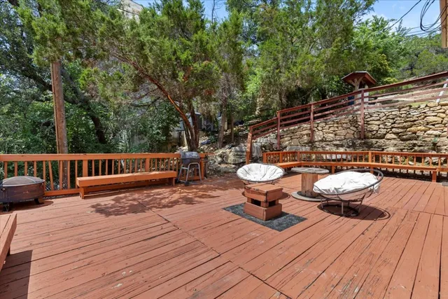 a view of a wooden deck and patio