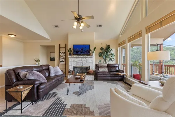 a living room with furniture and a fireplace