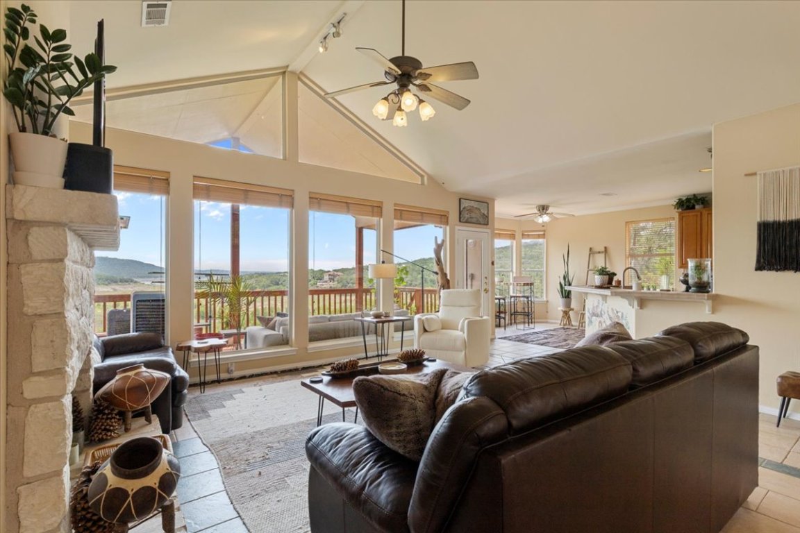 13612 Bullick Hollow Road Austin, TX 78726 - Photo 7 of 34 a living room with furniture ceiling fan and a floor to ceiling window