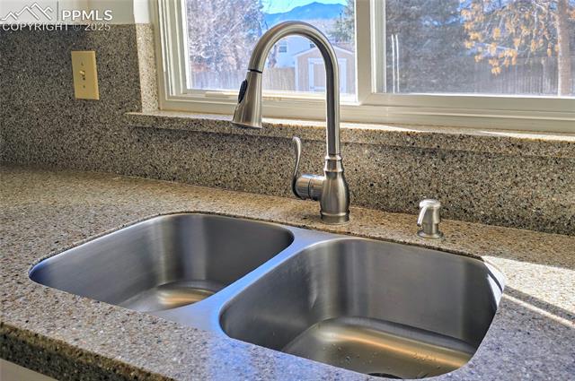 6313 Chippewa Road Colorado Springs, CO 80915 - Photo 21 of 36 Details featuring stone countertops and sink