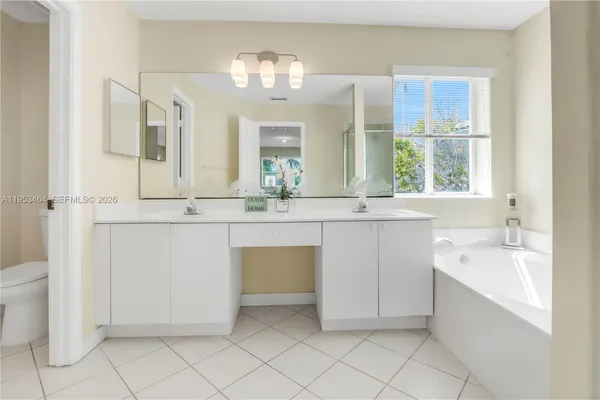 a bathroom with a sink a vanity and a mirror