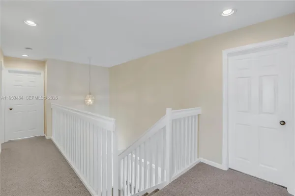 a view of a hallway with closet area