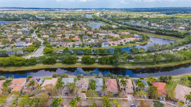 an aerial view of residential building and lake