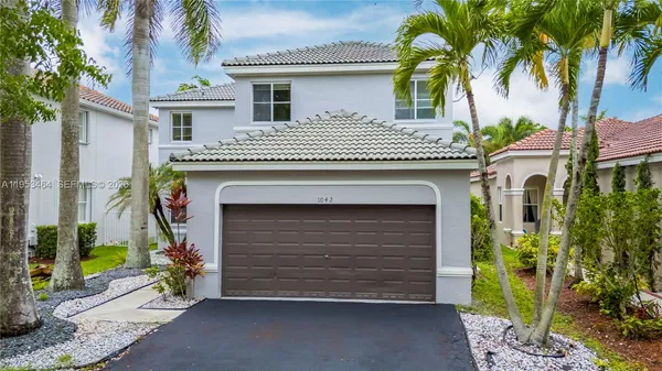 a front view of a house with a garage