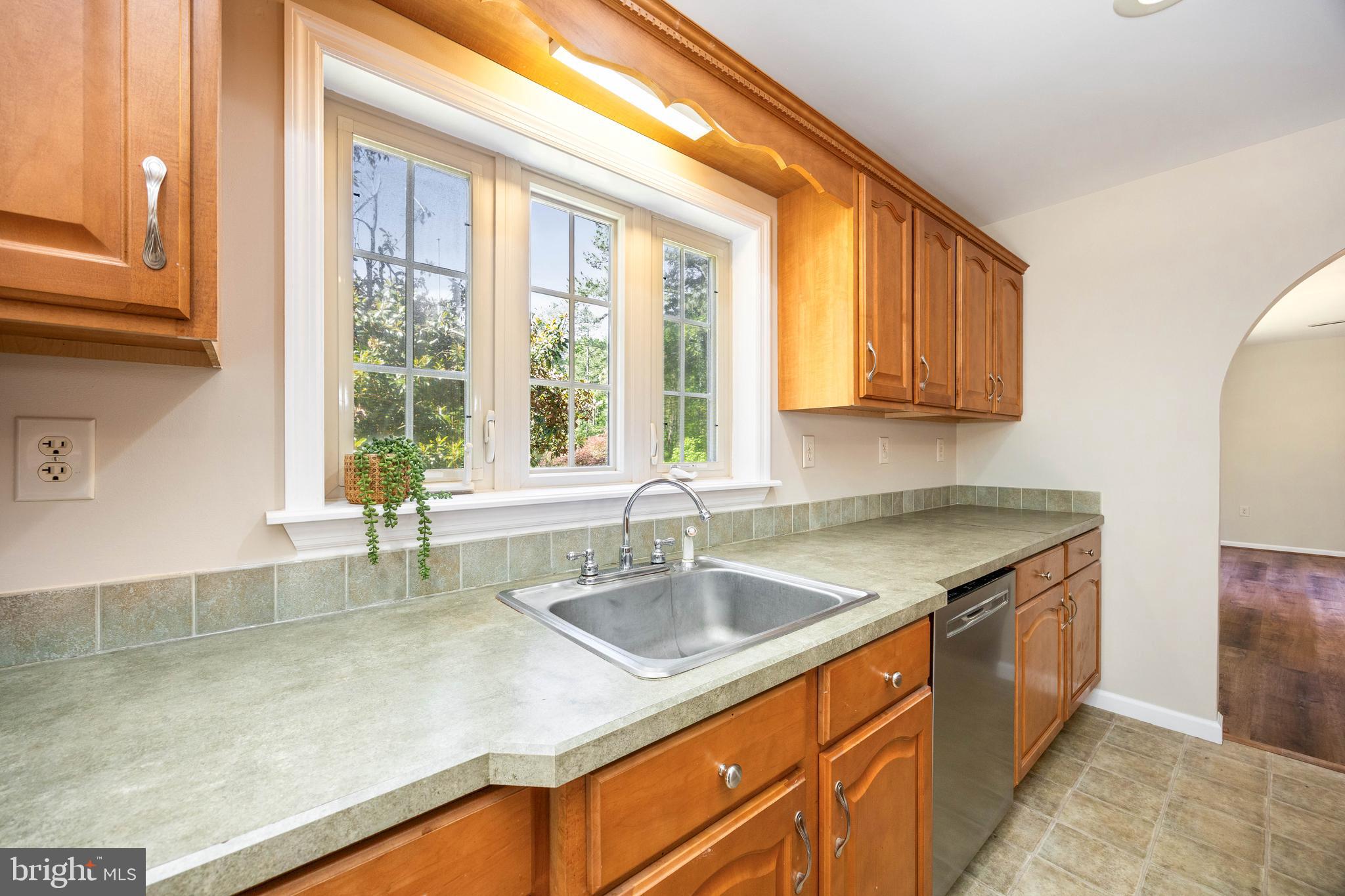 6635 Libertytown Road Berlin, MD 21811 - Photo 20 of 88 a kitchen with stainless steel appliances granite countertop a sink stove and cabinets