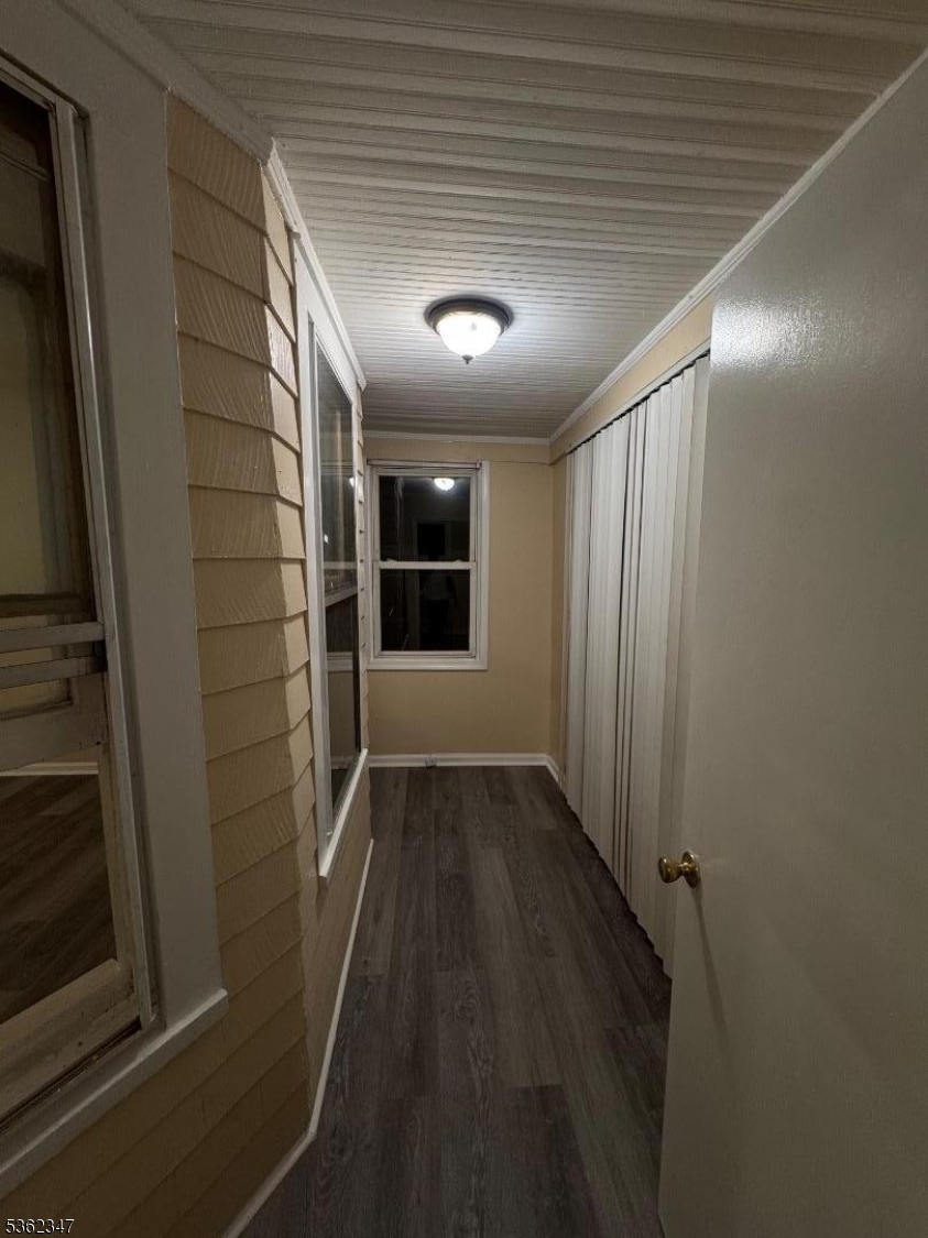 388 East 9th Avenue, Unit 2 Roselle, NJ 07203 - Photo 11 of 24 a view of hallway with wooden floor