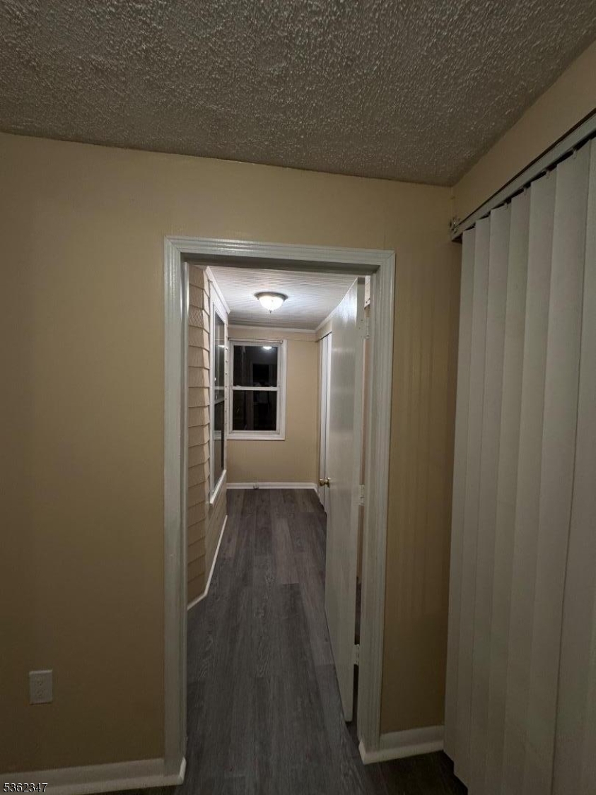 388 East 9th Avenue, Unit 2 Roselle, NJ 07203 - Photo 12 of 24 a view of a hallway with wooden floor