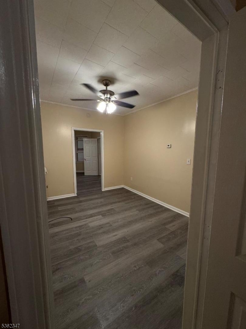 388 East 9th Avenue, Unit 2 Roselle, NJ 07203 - Photo 21 of 24 a view of an empty room with a chandelier fan
