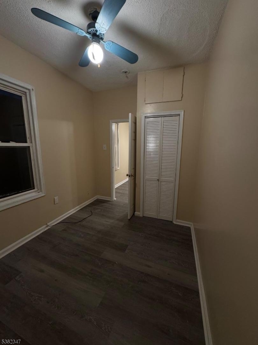 388 East 9th Avenue, Unit 2 Roselle, NJ 07203 - Photo 22 of 24 a view of an empty room with a fan