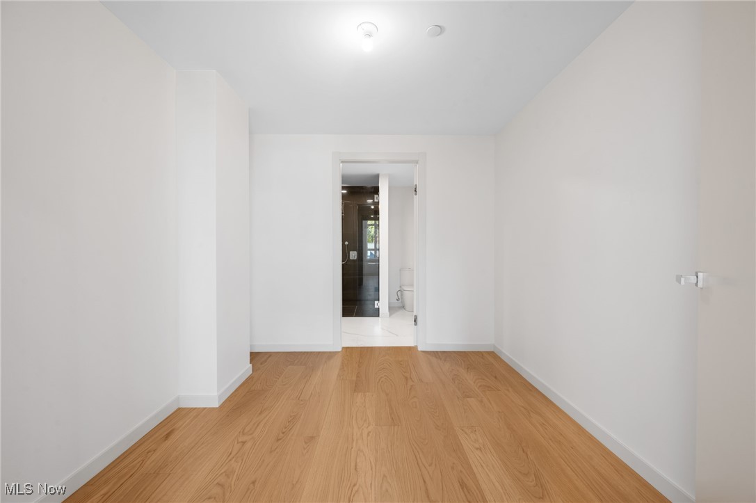 22700 Lake Road, Unit 204 Rocky River, OH 44116 - Photo 22 of 31 Empty room featuring light wood finished floors and baseboards
