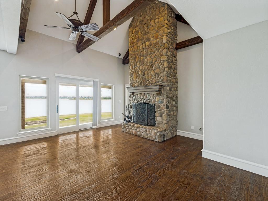 5975 Diamond Spur Frisco, TX 75036 - Photo 8 of 40 an empty room with wooden floor fan and windows