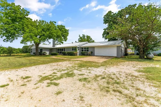 a view of a house with a swimming pool
