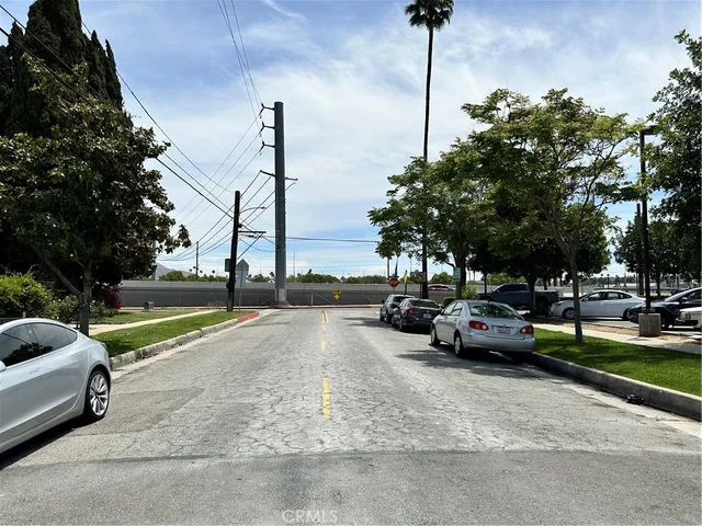 a view of a street with cars on road