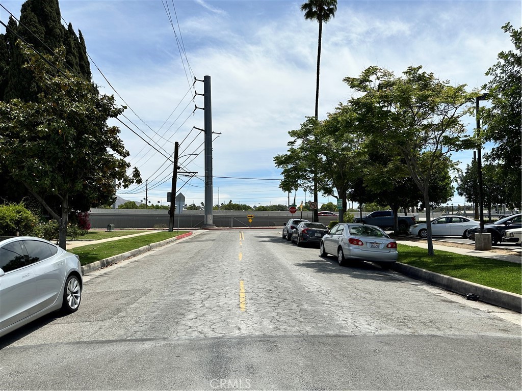 4308 Lime Street Riverside, CA 92501 - Photo 13 of 14 a view of a street with cars on road