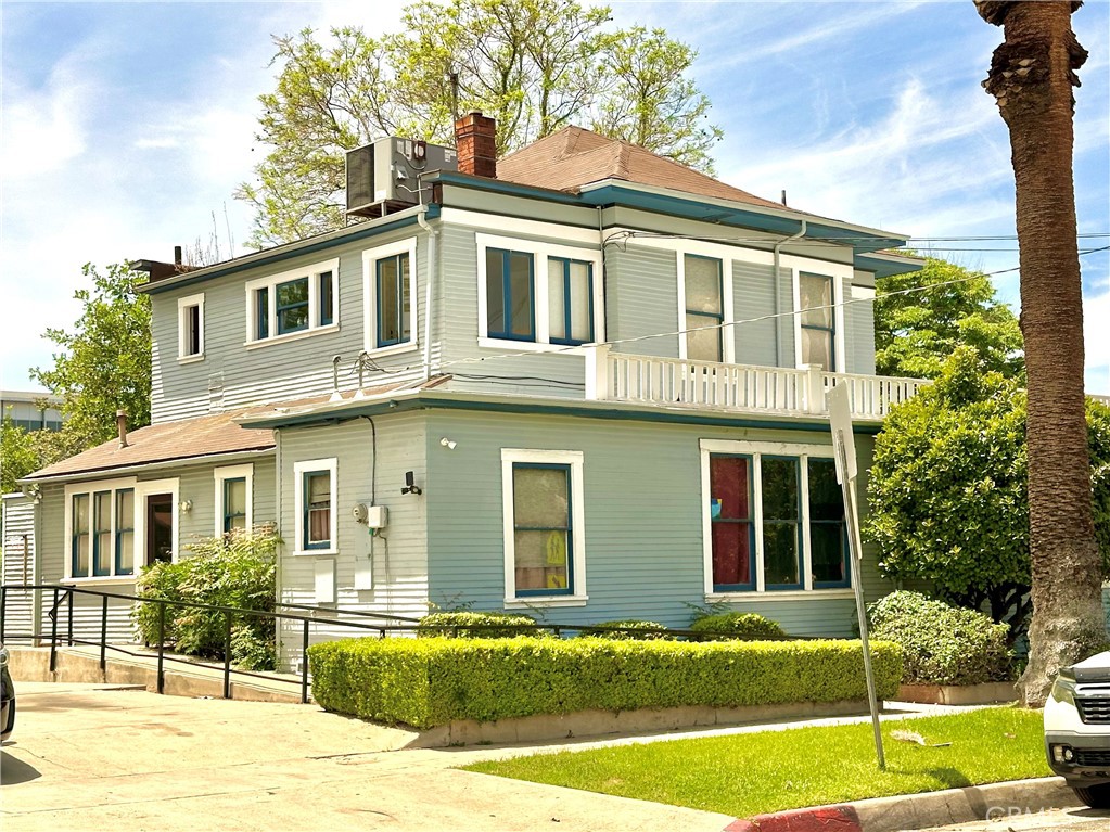 4308 Lime Street Riverside, CA 92501 - Photo 14 of 14 a front view of a house with a yard