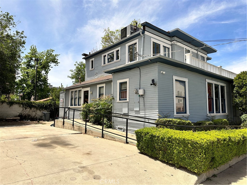 4308 Lime Street Riverside, CA 92501 - Photo 5 of 14 a front view of a house with a yard