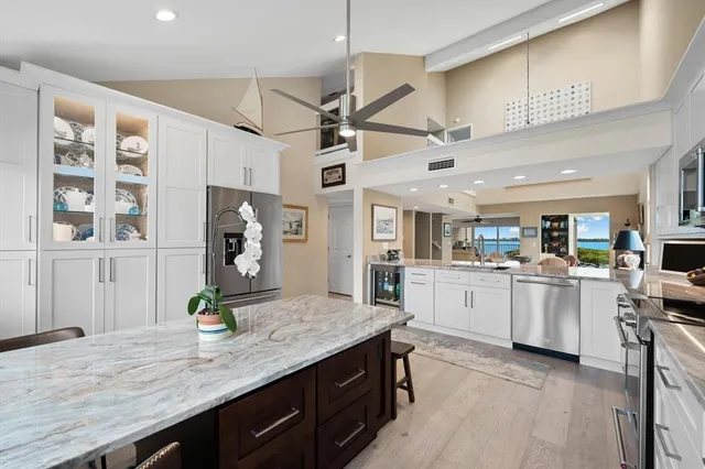 a kitchen with sink cabinets and wooden floor