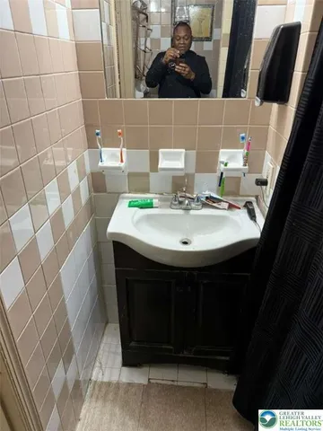 a bathroom with a sink and toilet