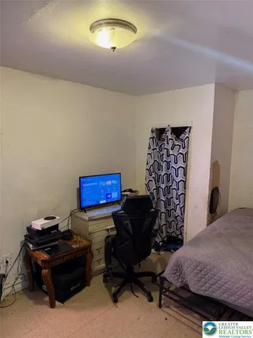 a room with furniture and wooden floor