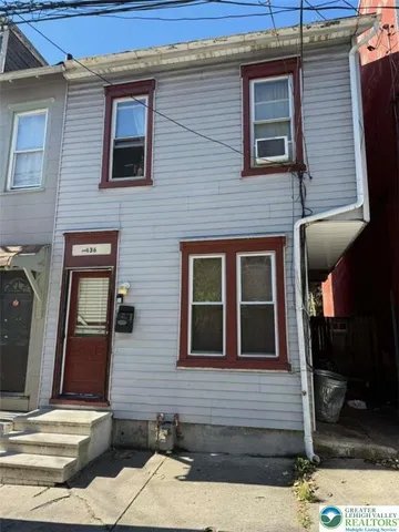a room with stairs and wooden floor